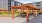 The outdoor lounge at our apartments in Plainsboro, featuring a shade structure, outdoor couches, and a view of the lawns.