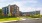 The Icon Riverwalk Apartments in Plainsboro, NJ, featuring a view of the apartment exteriors, lawn, and parking.