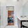 Model bathroom at our senior living apartments in Princeton, NJ, featuring white counters and a shower with a glass door.