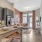 Model kitchen at our senior living apartments in Plainsboro, NJ, featuring a kitchen island and stainless steel appliances.