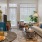 Model living room at our senior living apartments in Plainsboro, NJ, featuring wood grain floor paneling and couches.