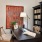 Model office at our senior living apartments in Plainsboro, NJ, featuring a desk with chairs and a bookshelf.