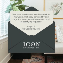 a review of Icon Riverwalk with a picture of a bedroom behind it